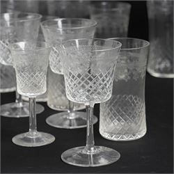 Suite of early 20th century cut and etched table glass comprising nine tumblers, ten smaller tumblers, eleven small wine glasses, six sherry glasses and water jug together with four other sherry glasses