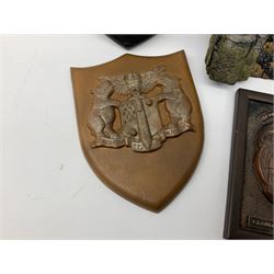 Terry Pratchett Discworld plaques, designed by Clarecraft, comprising 'the First Discworld Event Clarecraft August 95', the collectors guild joining shield, the fools guild DW99C, the seamstresses guild DW98C, the musicians guild DW00C together with 'Door of the mended drum' wall hanging DW17. 