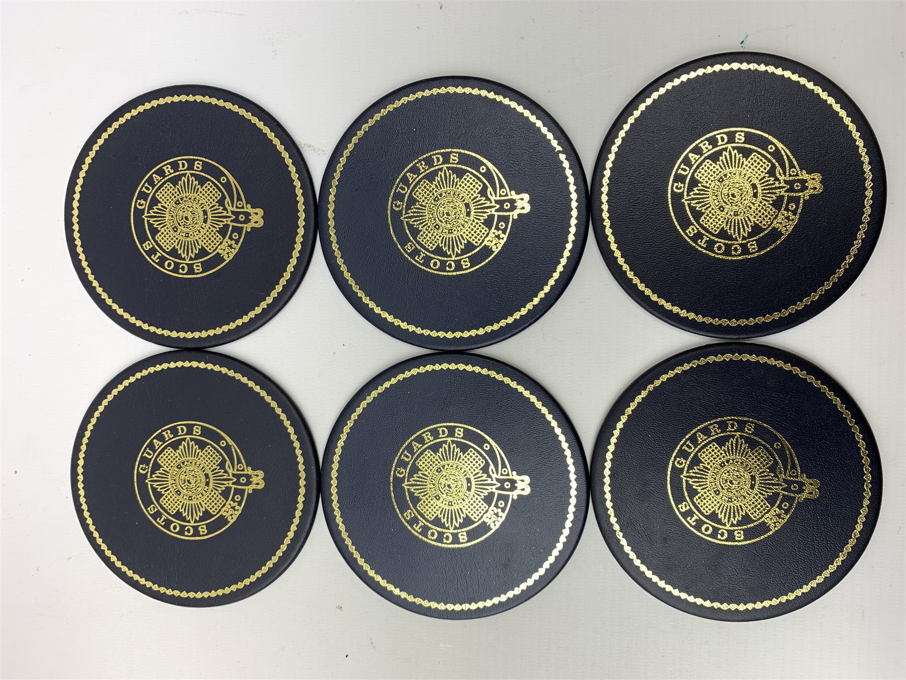 Scots Guards - three car badges by Beaulah, Gaunt etc; Military Drum Ice Bucket in original box; Regimental Crest on shield; boxed sets of table mats and coasters; two wallets; 45rpm record; ash trays etc