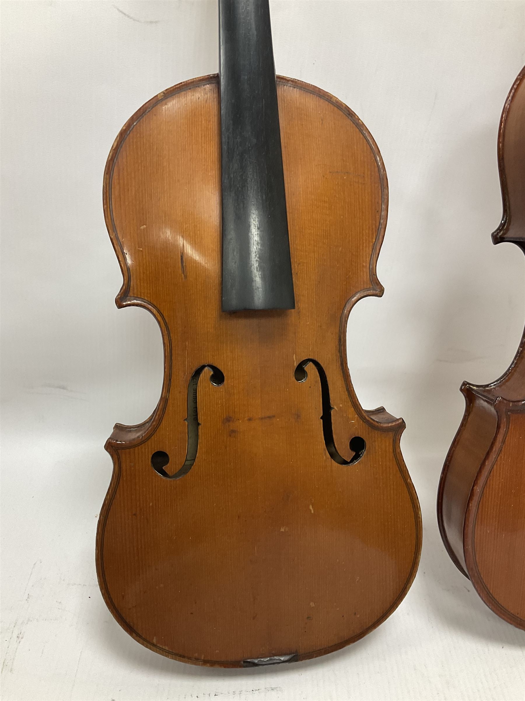 Four violins 1/8th size; half size with Nicolas Bertholini label; three-quarter size with Stradivarius copy label; and full size with Marquis De L'Air label (4)