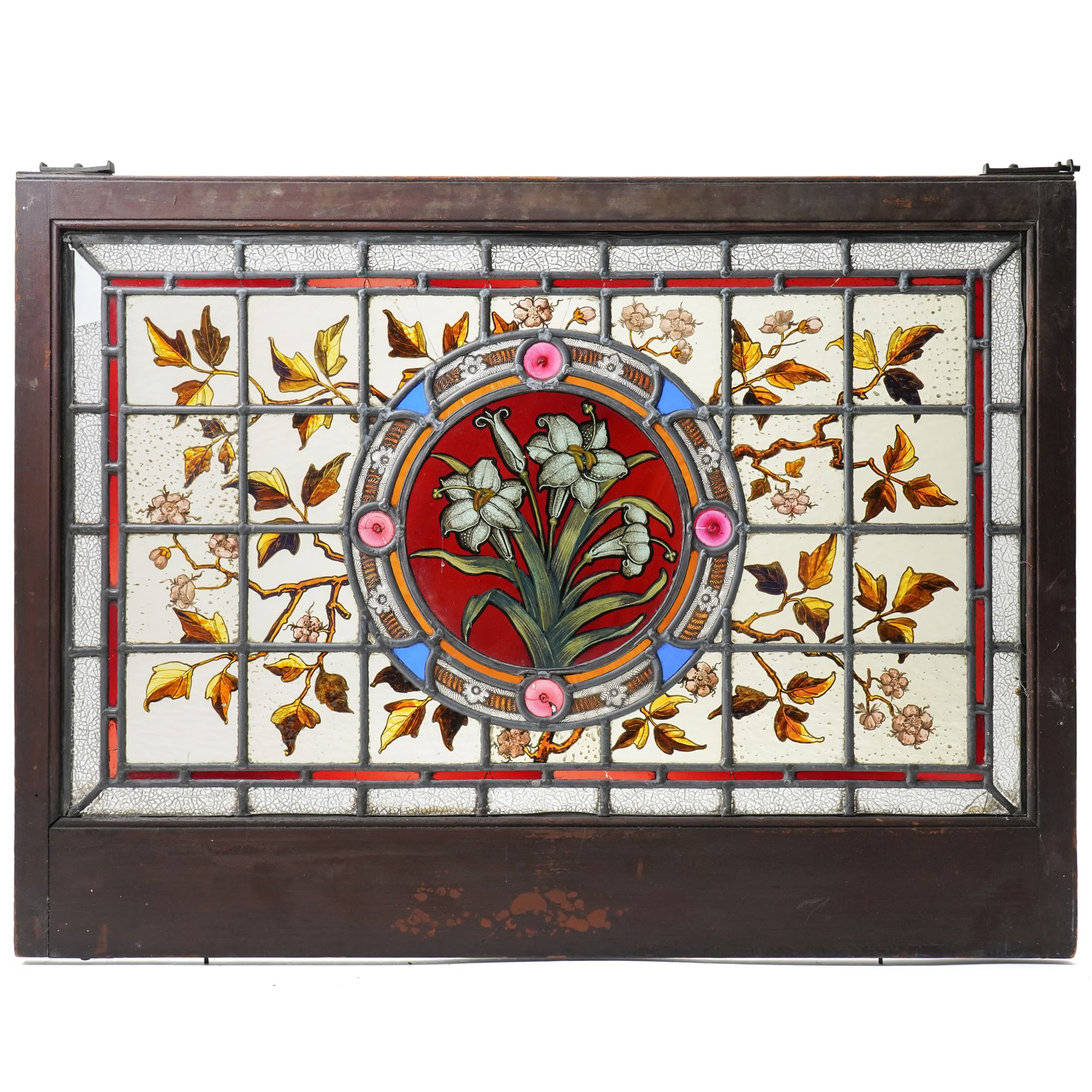Victorian Aesthetic movement stained glass leadlight window panel, the central panel hand painted with a sprig of daffodils, the surrounding panels profusely decorated with branches and leaves, overall 62cm x 84cm 
