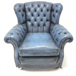 Georgian style wingback armchair upholstered in a deep buttoned blue leather, W91cm