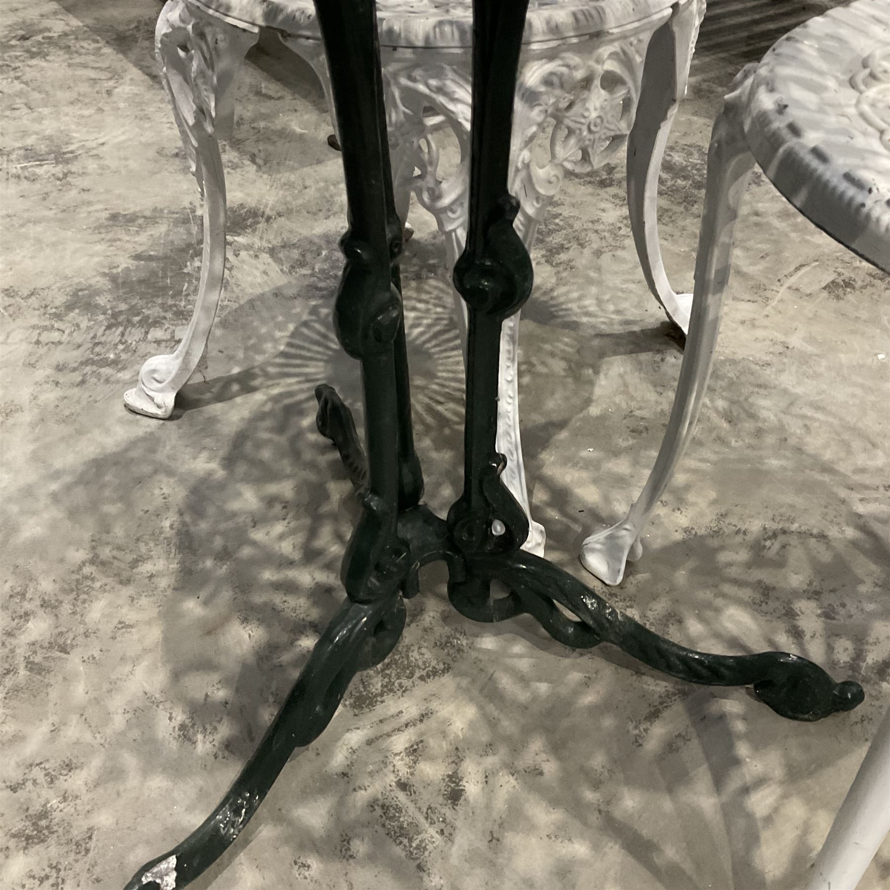 Cast aluminium green painter garden table and white painted chairs  - THIS LOT IS TO BE COLLECTED BY APPOINTMENT FROM DUGGLEBY STORAGE, GREAT HILL, EASTFIELD, SCARBOROUGH, YO11 3TX