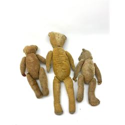 Early 20th century American wood wool filled short bristle mohair long bodied teddy bear with swivel jointed head, boot button eyes and vertically stitched nose and mouth and jointed limbs H23