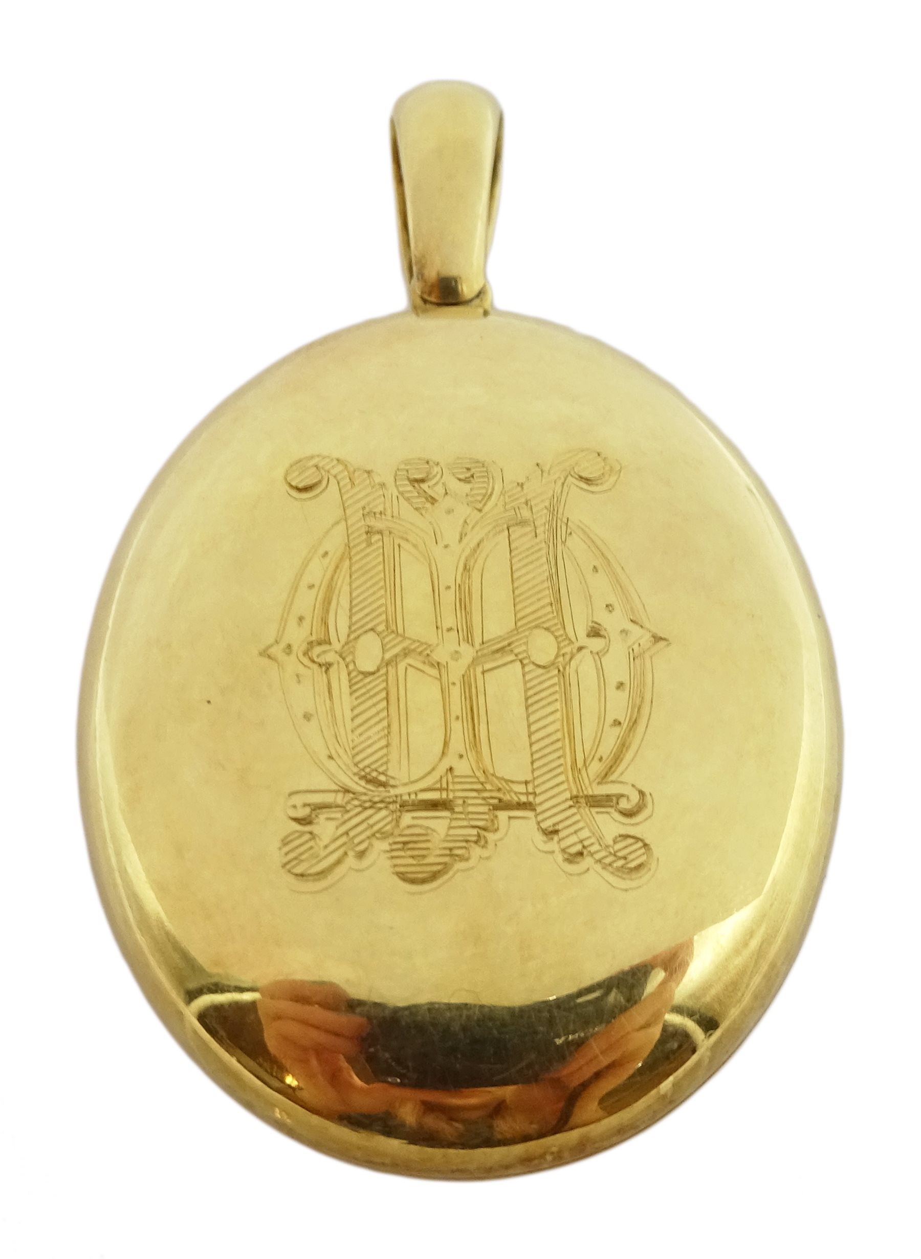  18ct gold oval hinged locket pendant, engraved initials on both sides, stamped 18 makers marks AD  