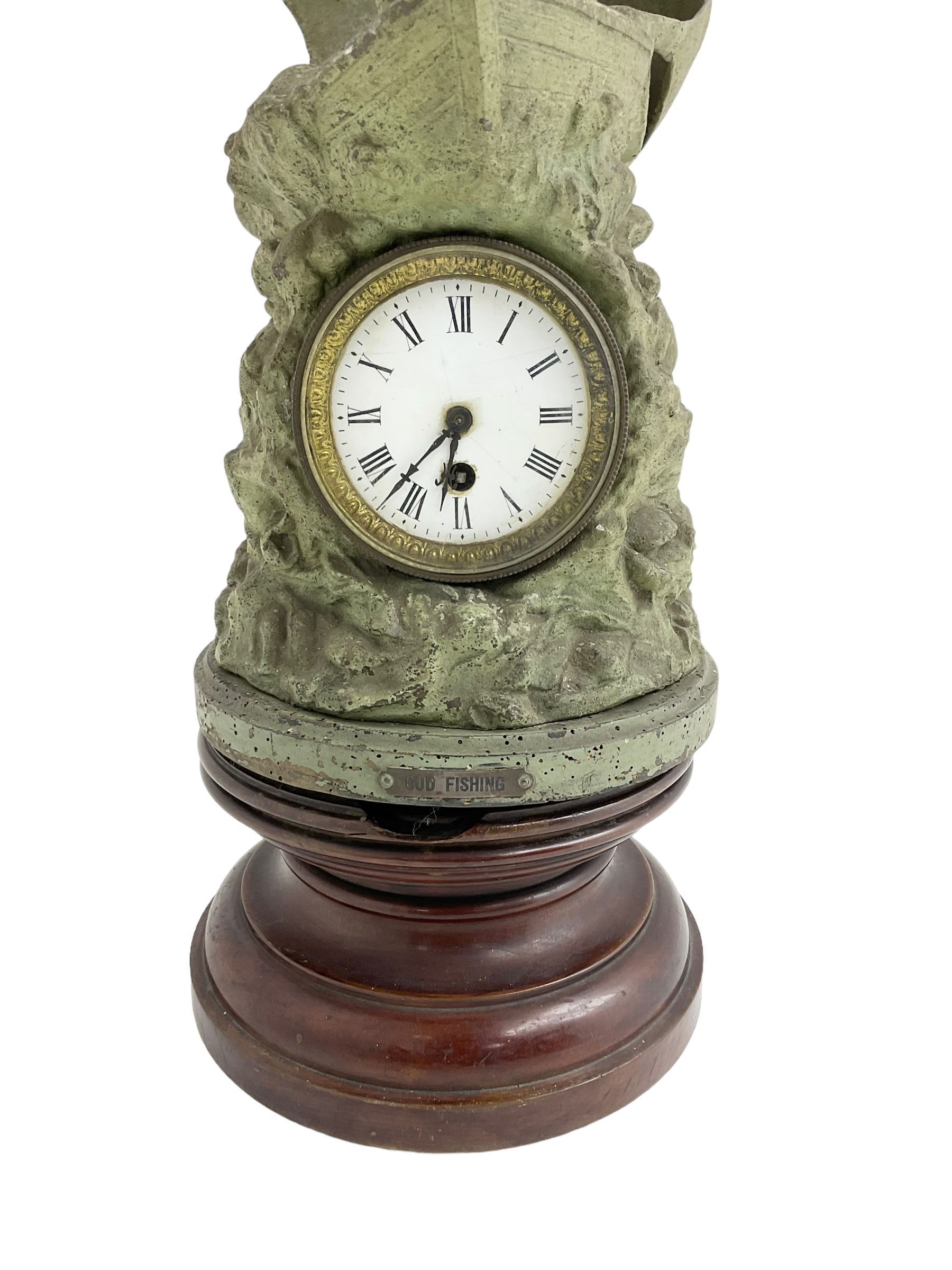Edwardian - Large figural clock with a Verdigris finish mounted on a mahogany plinth, detailed depiction of a fisherman in a sailing boat entitled 