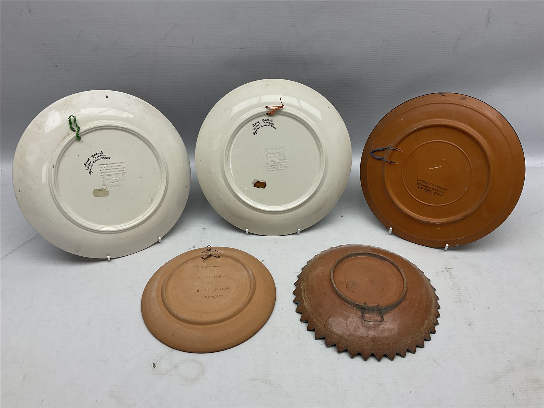 Two Greek Kerameikos plates together with a Kepamik plate and other Grecian style ceramics, carved African figures and treen, boxes etc 