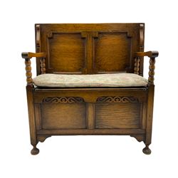 Early 20th century oak Monk's bench, bobbin turned supports with tilting and sliding top/back, hinged box seat, turned feet