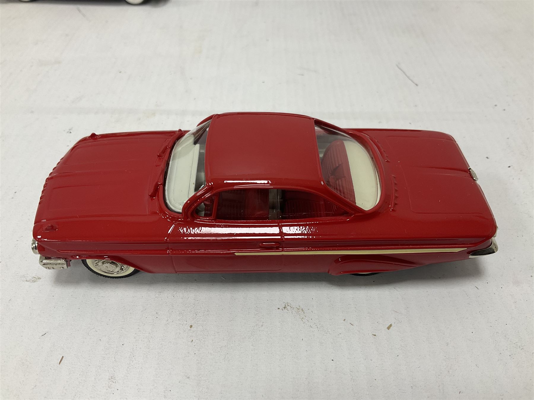 Brooklin Models - three 1:43 scale heavy die-cast model cars comprising BRK31 WMTC 1953 Pontiac Sedan Delivery in maroon with tan interior; BRK43 1948 Packard Station Sedan; BRK44 1961 Chevrolet Impala Sport Coupe; all boxed (3) 