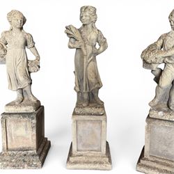The Four Seasons - set of four traditional cast stone garden figures, in a weathered finish, stamped 'Lucas'