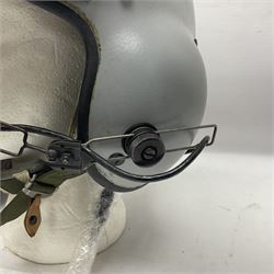 Silver grey SPH-4B Flight Helmet as used by helicopter pilots in the USAF and US Army in the 1990s; made of epoxy resin reinforced fibreglass; fitted with clear and tinted visors and complete with an M-87A/AIC boom mike; original condition and bench tested.
