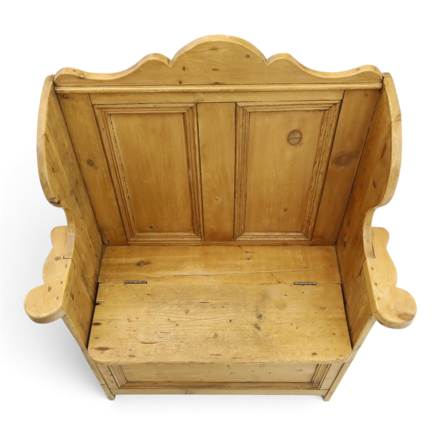 Victorian waxed pine settle or hall bench, shaped cresting rail over double panelled back, outswept arms on hinged box-seat, on end supports