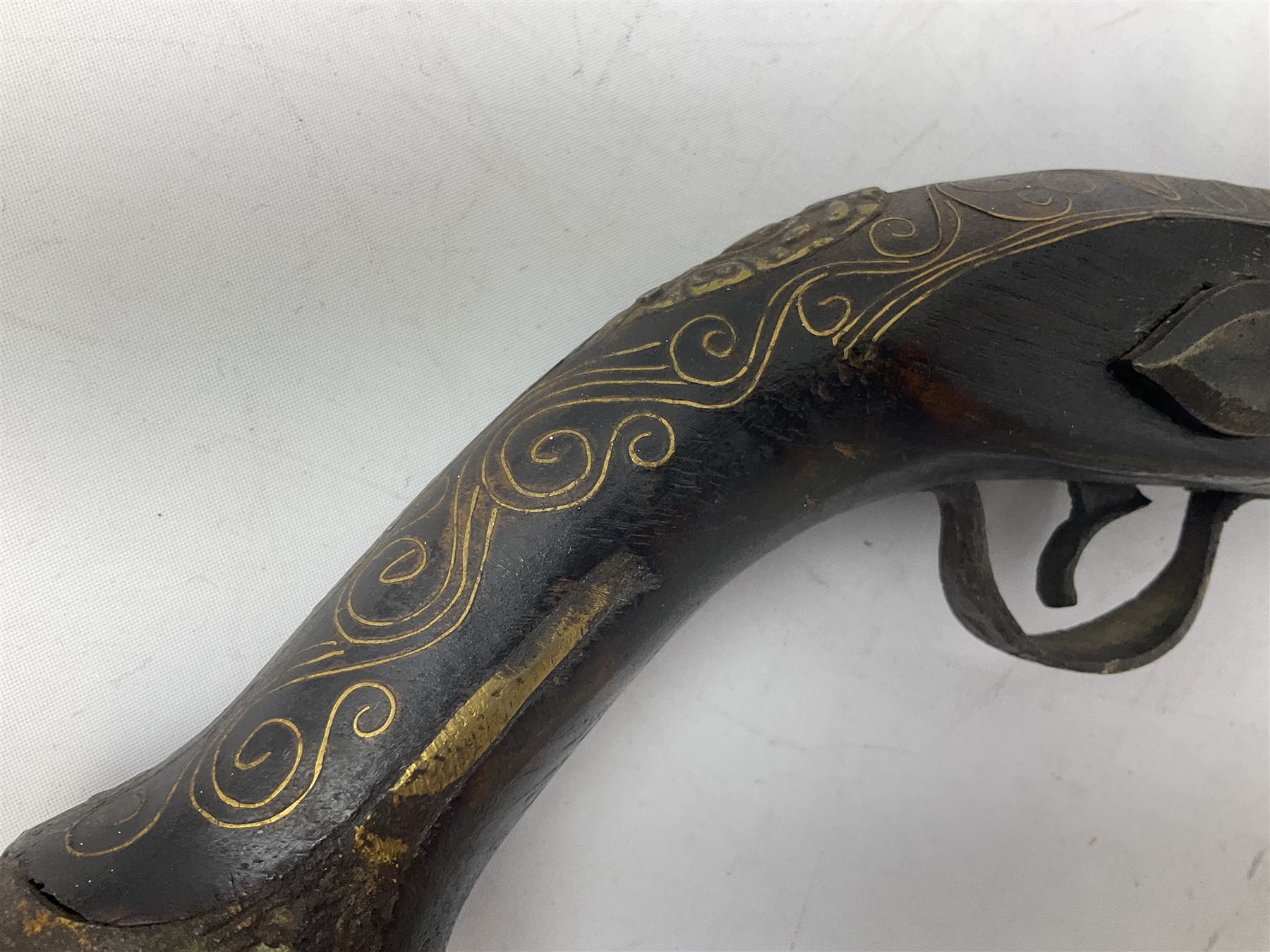 REGISTERED FIREARMS DEALERS ONLY - Reproduction flintlock pistol, the full walnut stock with brass filigree inlay and mounts and skull crusher butt L46cm; no visible proof marks - Disposed 25.06.25 - Notified 24.07.25