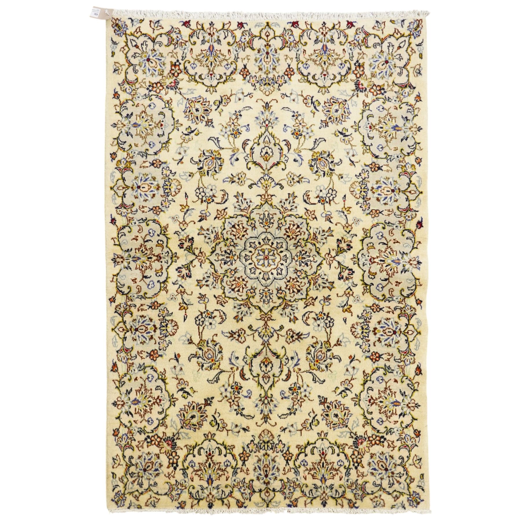 West Central Persian Sarough hand-knotted rug, ivory field with central lobed medallion issuing an all-over design of scrolling vines, palmettes, and floral sprays within conforming spandrels enclosed by a complementary foliate border flanked by guard stripes, with cotton fringe ends 