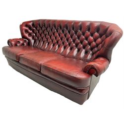 Wade - Georgian design three-seat sofa, high curved back over scrolled arms, upholstered in deep buttoned oxblood 'Pegasus' leather, on castors