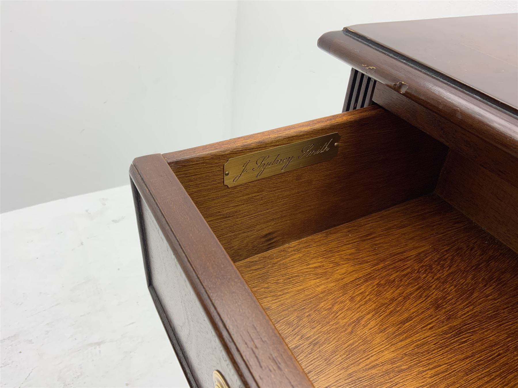 Sydney Smith - mahogany sideboard, cross banded and inlaid detail, three short drawers above three adjustable shelves, raised on platform base