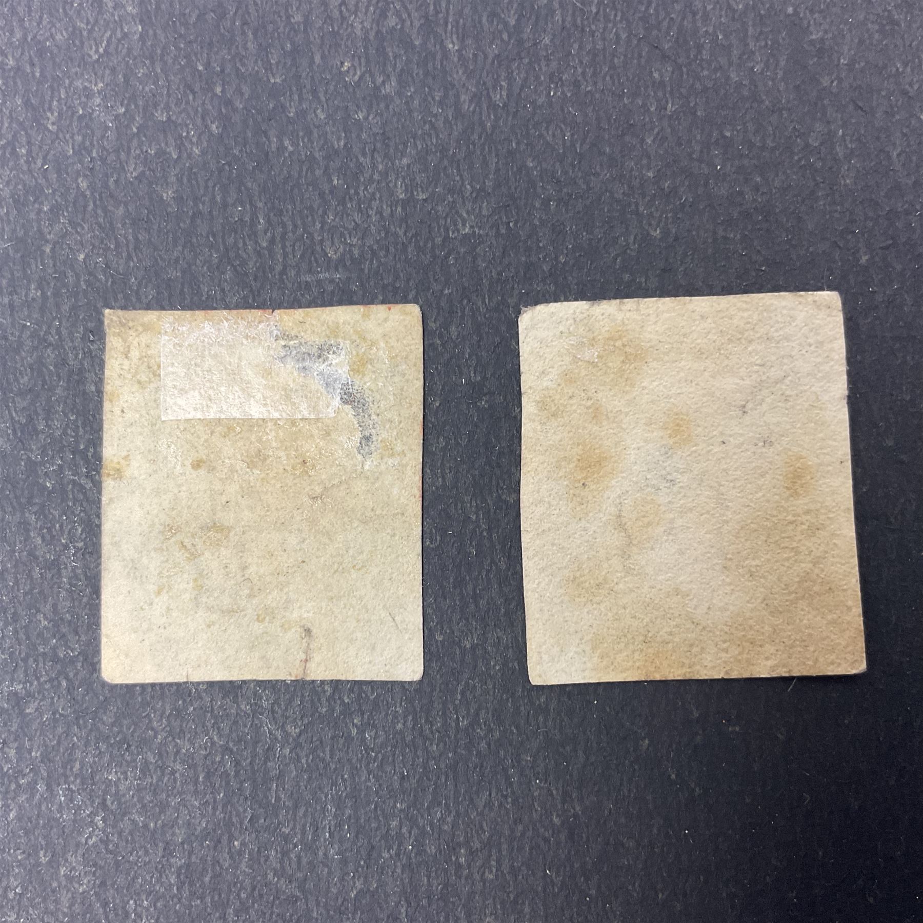 Two Great Britain Queen Victoria penny black stamps, both with red MX cancels