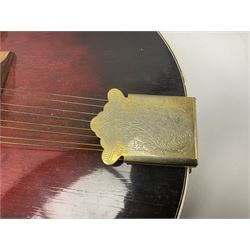 Eastern eight-string mandolin with sunburst finish and mother-of-pearl inlay L68.5cm; and another Harmony mandolin with cracked headstock (2)