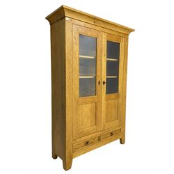 Oak display cabinet, enclosed by two panelled and glazed doors and fitted with two drawers, three internal shelves