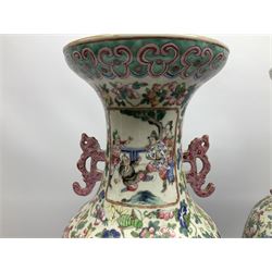 Pair of large 19th century Chinese Famille Rose porcelain vases, each of baluster form with twin zoomorphic handles, decorated in enamels with panels of lively court scenes, against a ground painted with blossoming flowers, fruiting vines, birds, grasshoppers and butterflies, between ruyi and key borders, H60cm
