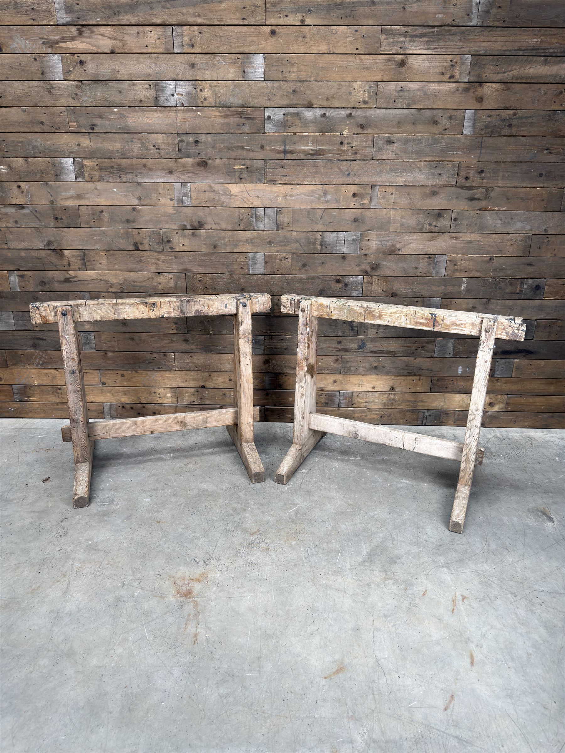 Pair of late 19th century pitch pine trestles, square tapering form in stripped finish