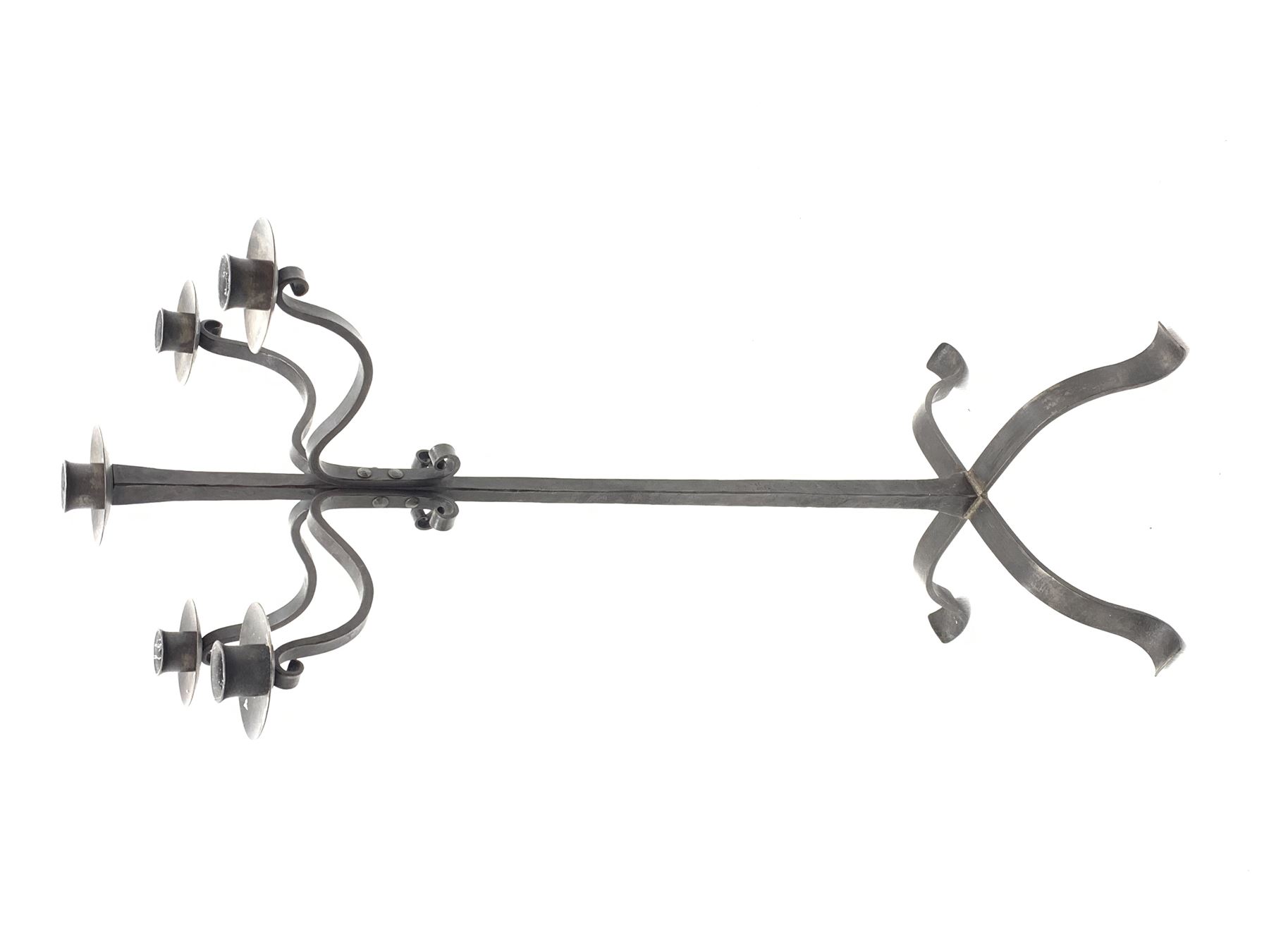 Wrought hand forged iron candle stand, four scrolled branches and central vertical branch with sconces, tapered column on four shaped and out splayed supports