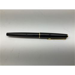Montblanc 320 fountain pen, with black resin body, gold coloured clip and banding, and white emblem to cap terminal, the nib marked 585