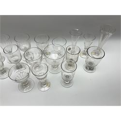 A group of Victorian drinking glasses, comprising mostly rummers, many with part slice cut bowls. 