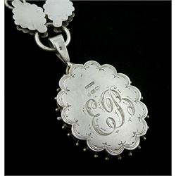 Victorian silver locket pendant, engraved and applied gold foliate and floral decoration, engraved initials EB on the reverse, makers mark W & Co, Birmingham 1881, on similar Victorian silver chain