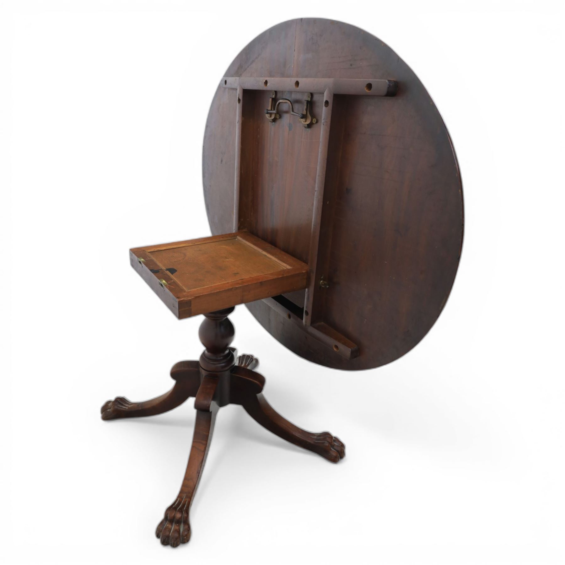 Victorian mahogany dining suite, oval tilt top dining table raised on a quatriform base with paw feet, together with a set of six balloon back dining chairs with green upholstery with cabriole legs 