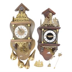 Two 20th century replica Dutch weight driven wall clocks.