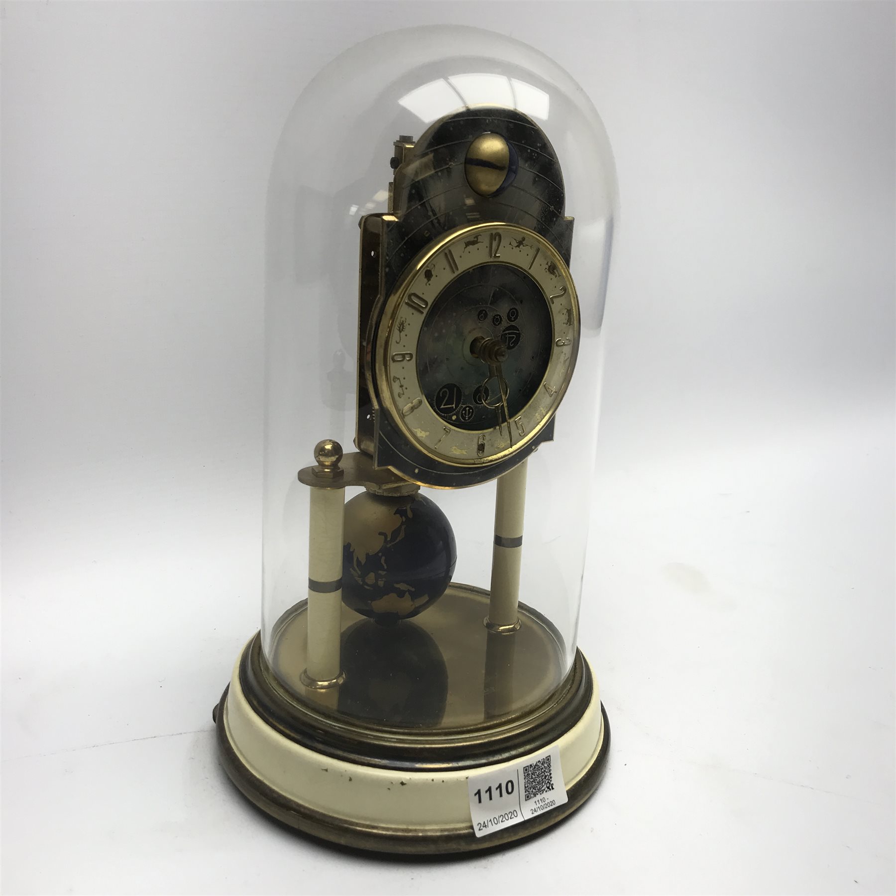 1950s Kaiser 'Universe' 400 day anniversary clock, moonphase dial with Arabic chapter ring decorated with the zodiac signs, globe pendulum, under glass dome, H27cm