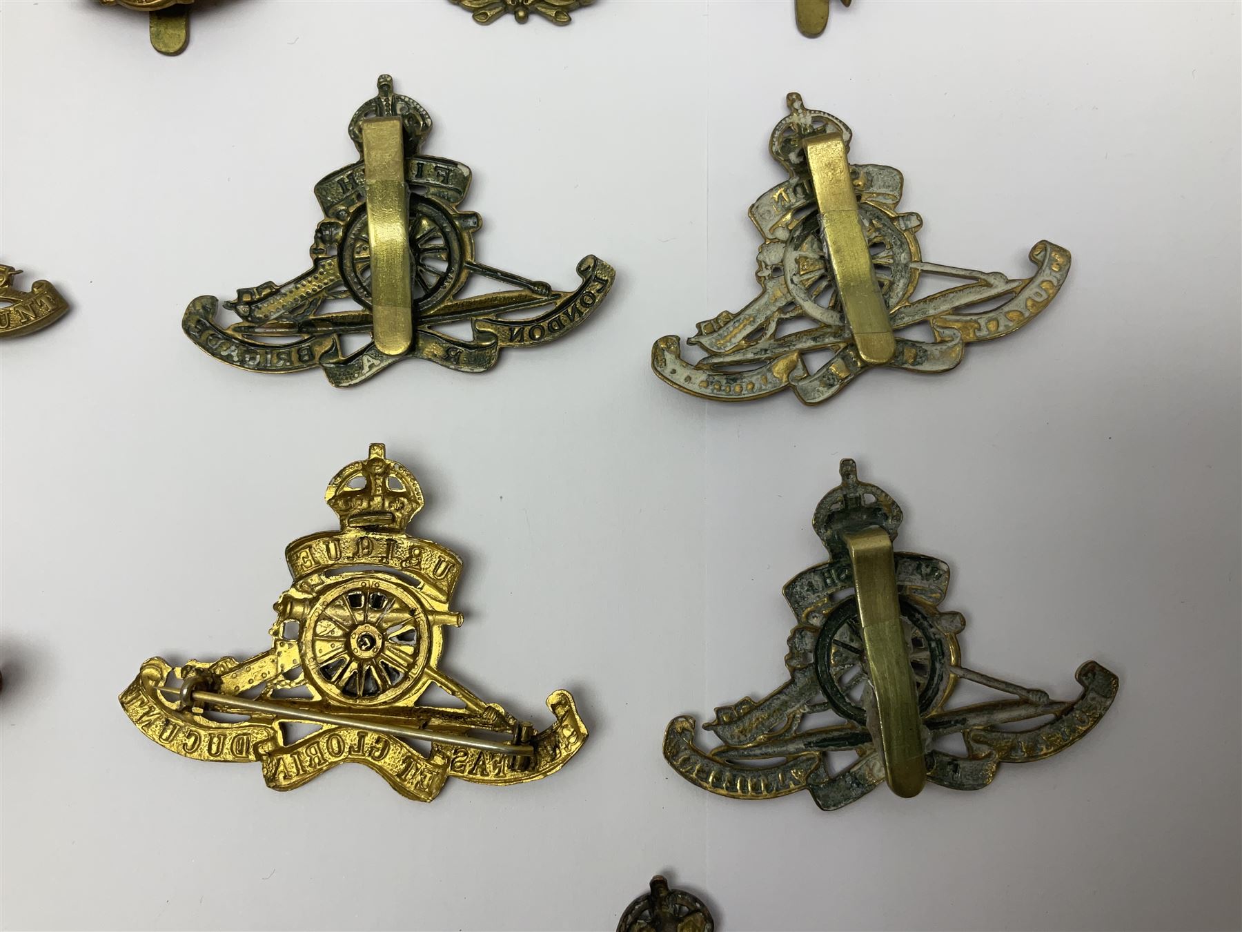Twelve cap badges including Royal Artillery, 3rd RGA Middlesex Volunteers, Hon. Artillery Company, West Riding and Waraickshire Royal Horse Artillery, Royal Engineers and Army Service Corps (12)