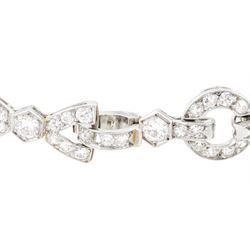 Art Deco platinum diamond bracelet, circa 1920, articulated openwork circular and geometric links, milgrain set with old cut diamonds and baguette cut diamonds, total diamond weight approx 3.85 carat
