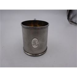 1920s silver christening mug, of slightly tapering cylindrical form, with engine turned decoration and engraved oval cartouche, hallmarked Ollivant & Botsford, Birmingham 1928, H8cm