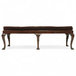 Early 20th century mahogany window seat in the George II style, with rectangular padded seat upholstered in brown velvet, raised on cabriole legs with carved shell knees and pad feet