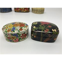 Eleven lacquered boxes including oval  and rectangular examples, with floral decoration, largest L12cm, D9cm