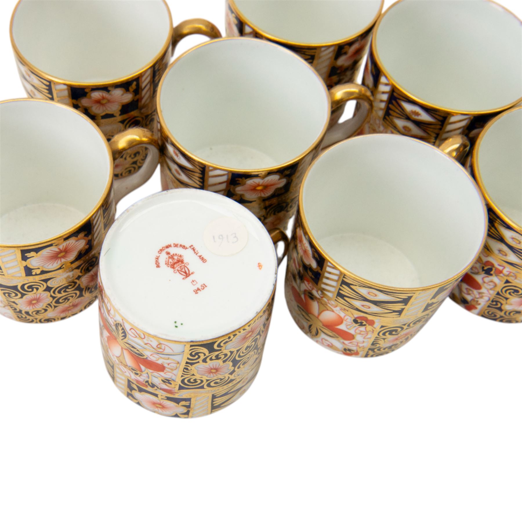 Royal Crown Derby Imari 2451 pattern, part tea service comprising eight coffee cans and saucers and seven cake plates 