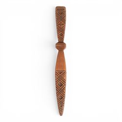 19th Century fruitwood goose-wing knitting sheath, decorated with geometric patterns, with a inset bone bust initialled A.B, together with a carved peg knitting stick, sheath L26cm
