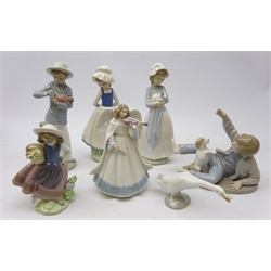  Three Lladro figures: 'Angelic Violinist' no. 6126, Girl with Flowers no. 522 and Goose & four Nao figures (7)  