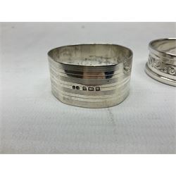 Pair of silver knife rests, (one a/f), and two silver napkin rings, approximate 84 grams, plus a silver plated Royal Commemorative napkin ring 