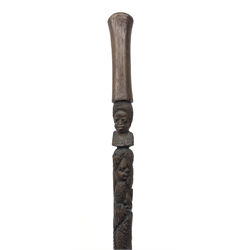  Carved hardwood tribal walking stick, shaft carved with figures and with tapering handle, L95cm  