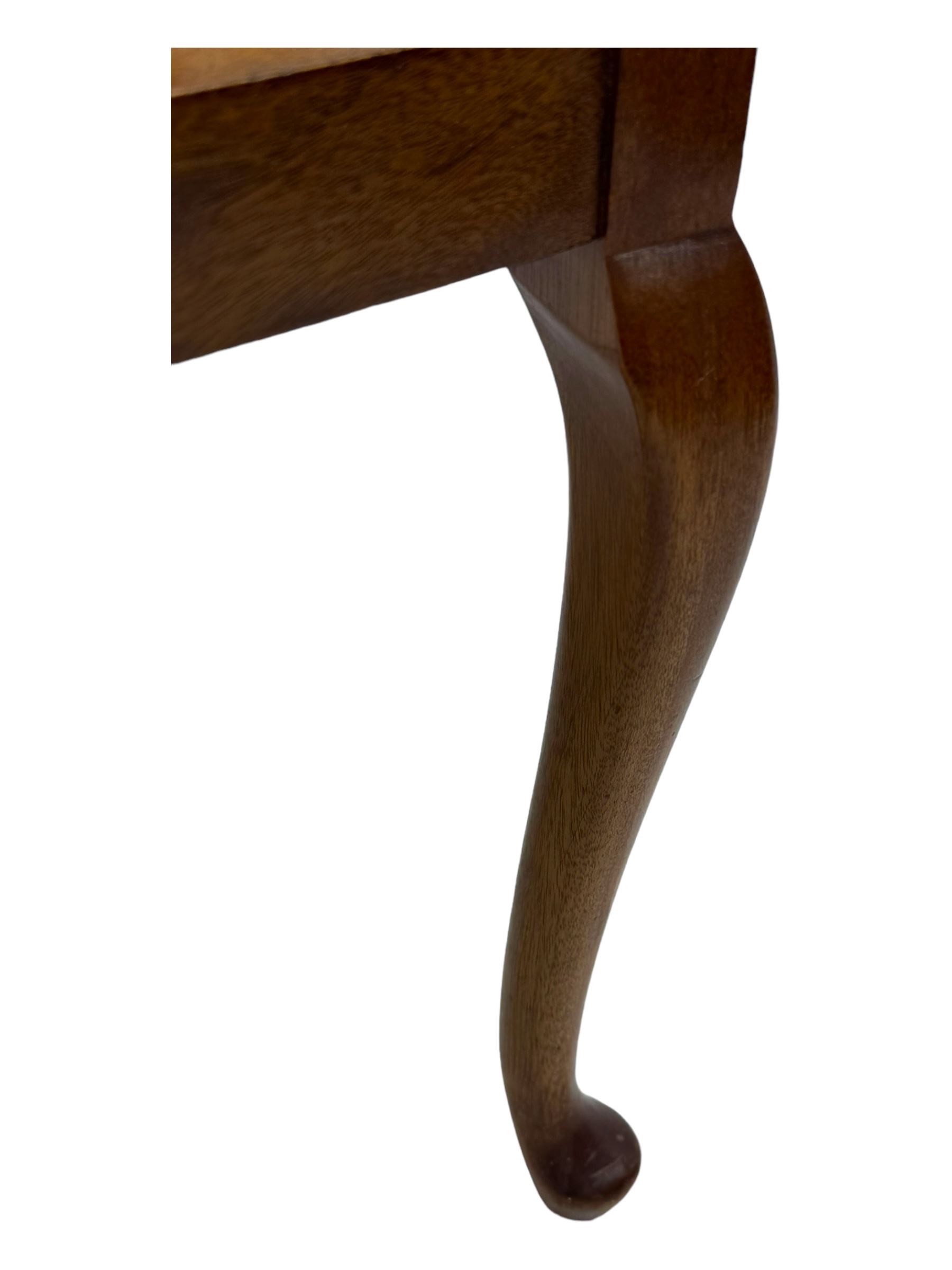 Late Victorian mahogany framed tub chair, rounded backrest with vertical splats and three carved oval medallions, upholstered seat in yellow patterned fabric, on cabriole supports