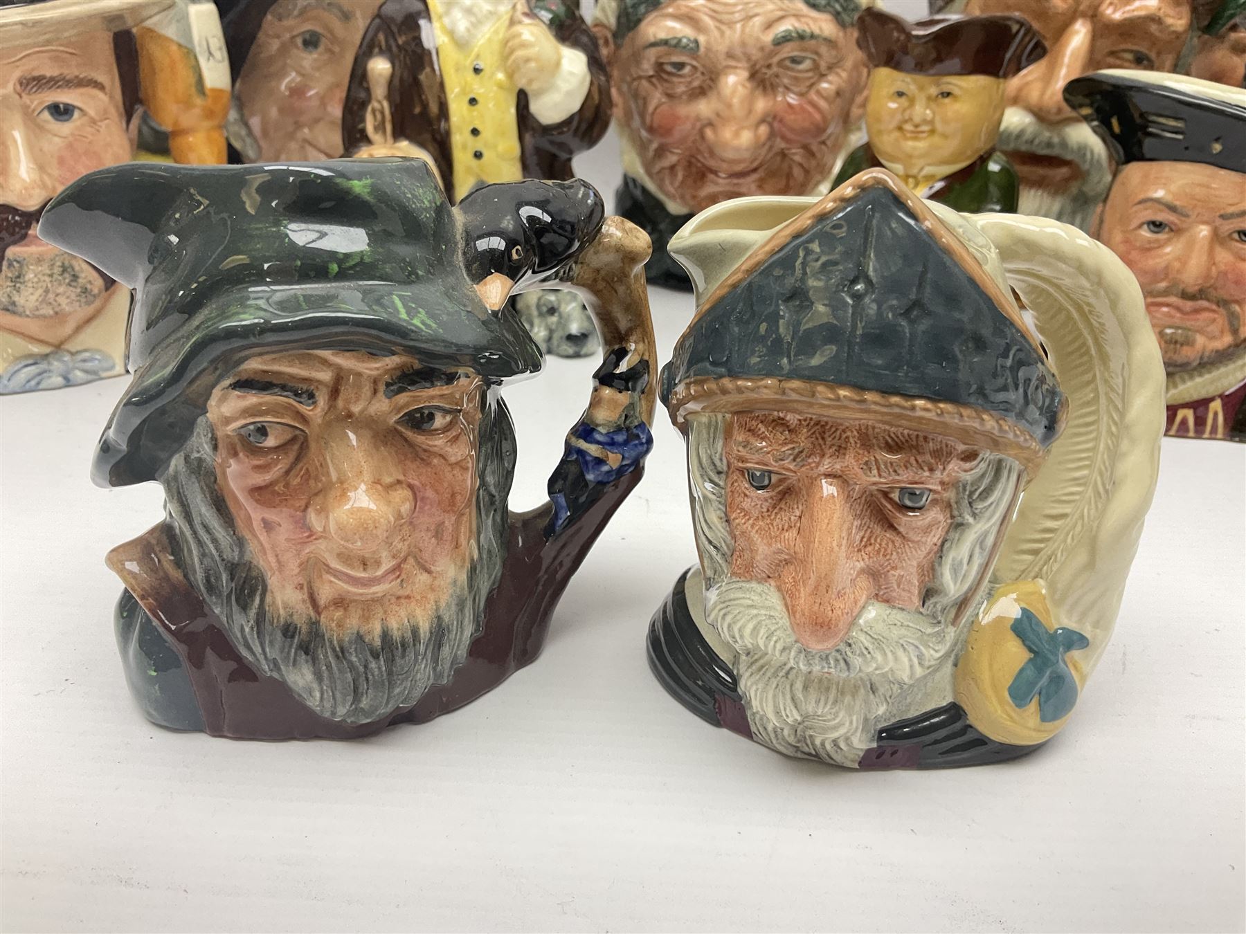 Large collection of Royal Doulton character jugs, to include Robinson Crusoe D6532, Tam O Shanter D6632, The Falconer D6533 etc, together with similar charater jugs and toby jugs   