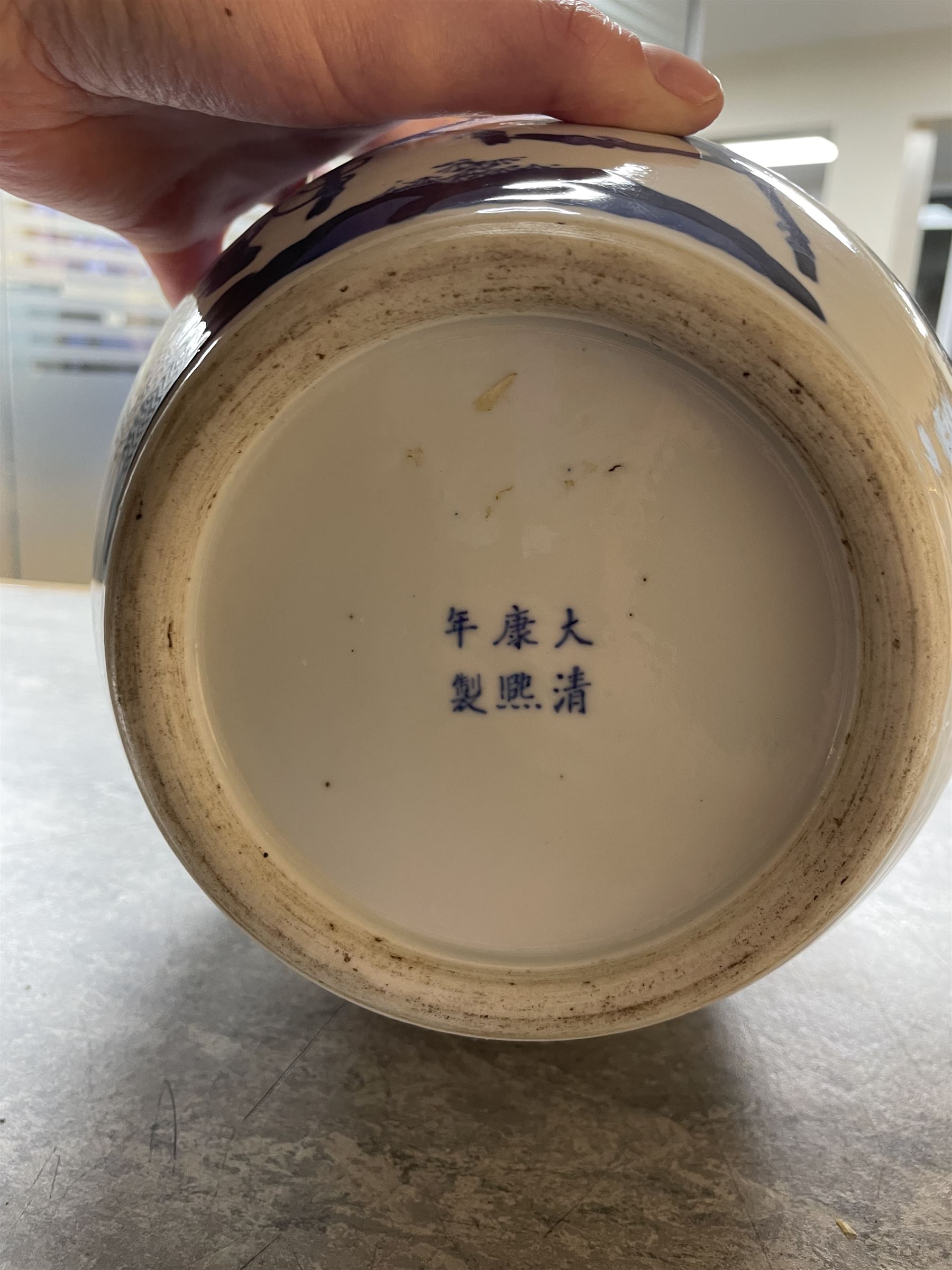 Late 19th century Chinese blue and white ginger jar, of ovoid form with flat topped circular cover, the body decorated with a geisha on reindeer with attendant in a landscape setting, with apocryphal Kangxi mark beneath, H24cm