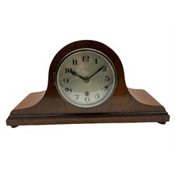 A light oak cased Tambour clock with a German 8-day movement sounding the quarters and hours on gong rods, with a 6” silvered dial , Arabic numerals and minute track, steel spade hands within a spun brass bezel and convex glass.
With pendulum. 








