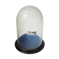 Glass dome shade, various glass decanters and coloured glass bottles