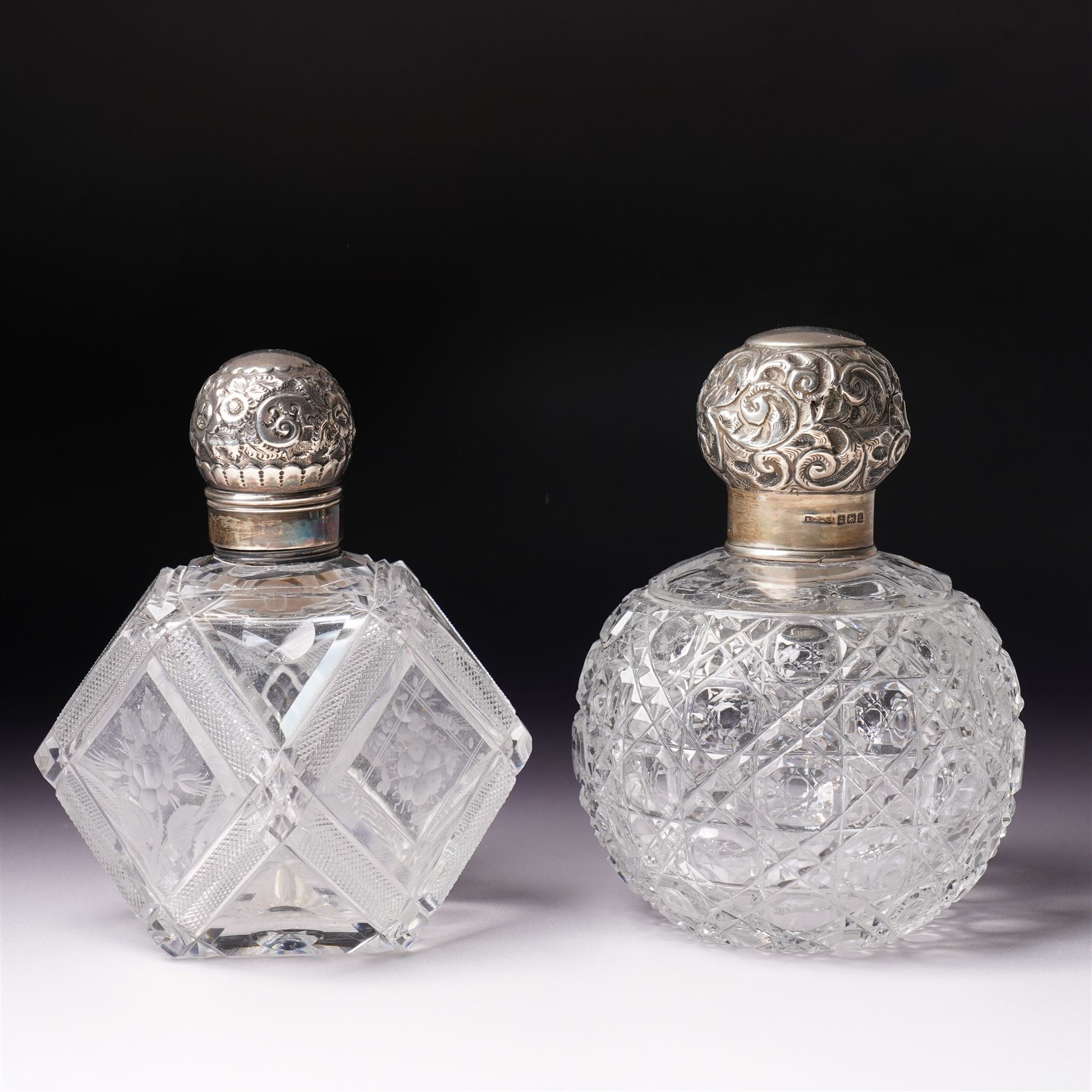 Edwardian glass globe scent flask with silver cover H13cm Birmingham 1905 and another of etched panel sided form with silver cover by Hilliard &Thomason (2)