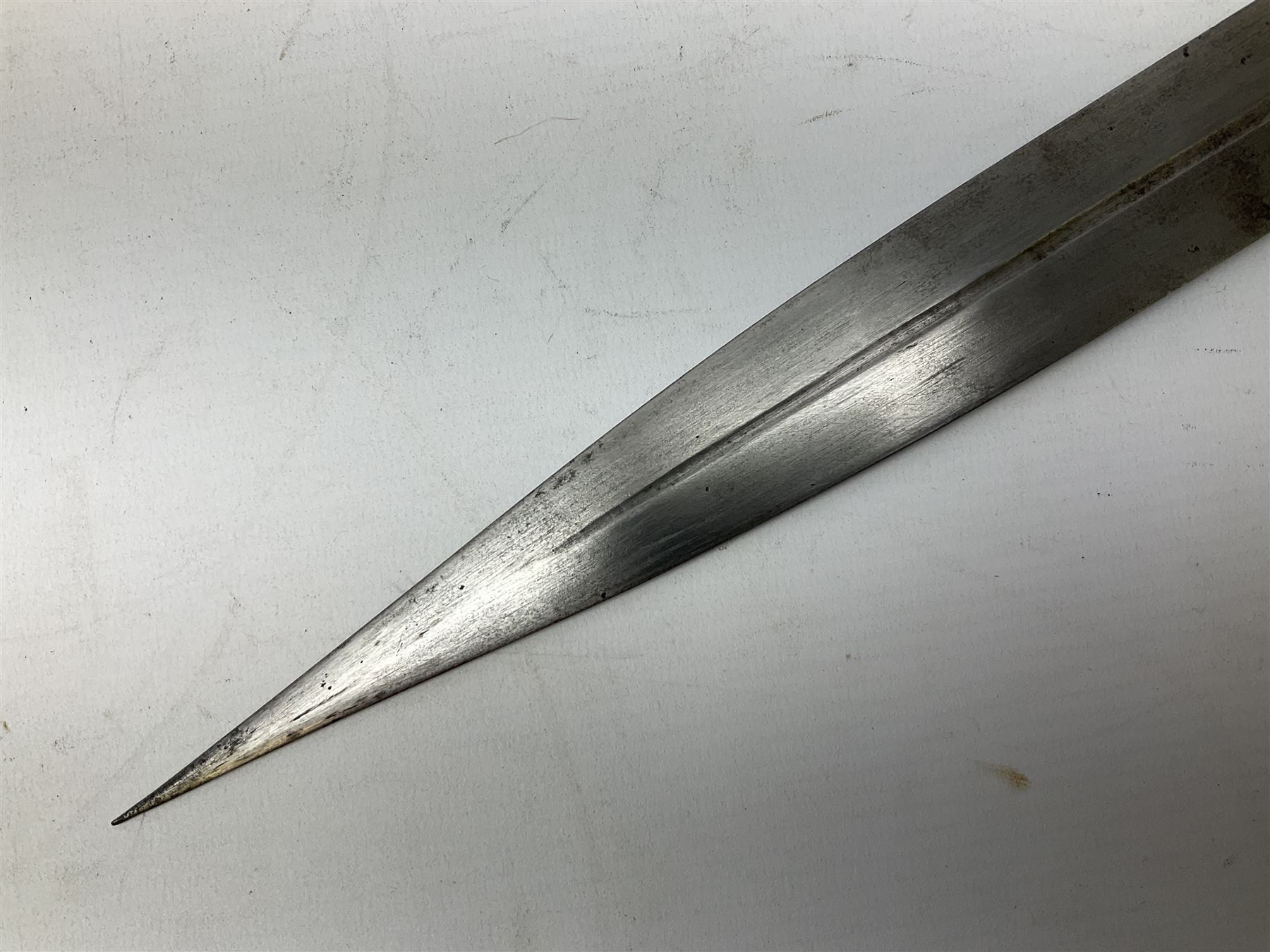 19th century Khanjali dagger, 33.5 cm double edged fullered blade with stamped makers marks, ornate cast grip, with engraved white metal scabbard, 46cm overall