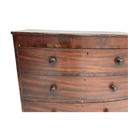 Early 19th century mahogany and mahogany banded bow-front chest, plain frieze over over three drawers, on turned feet